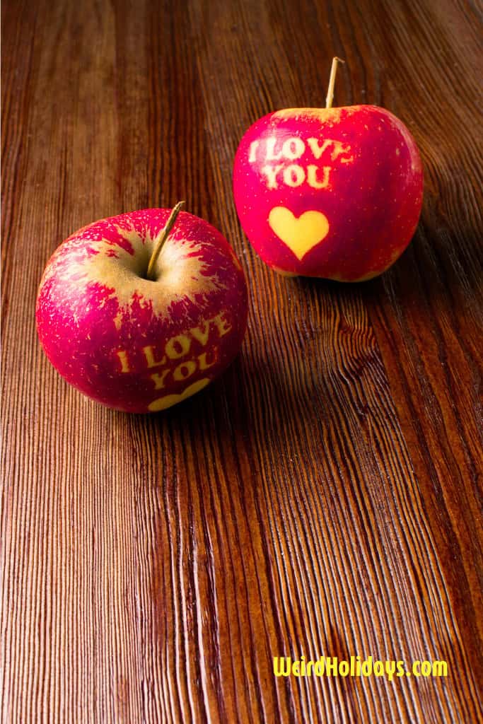 2 carved apples with i love you written on