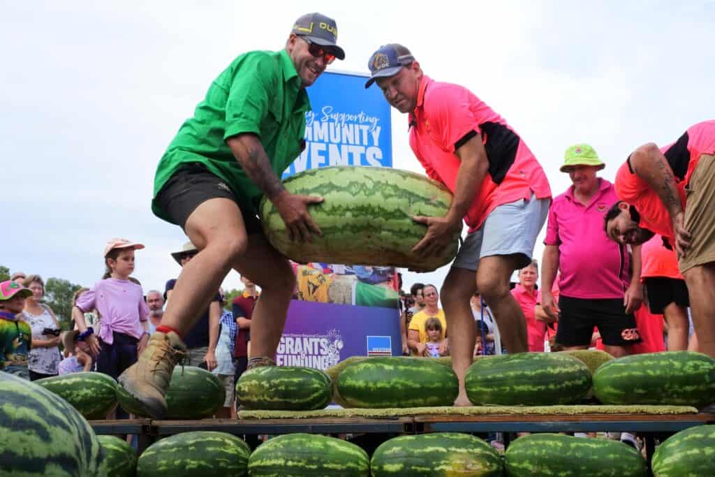 Competitors carrying a giant watermelon at the Chinchilla Melon Festival in Australia