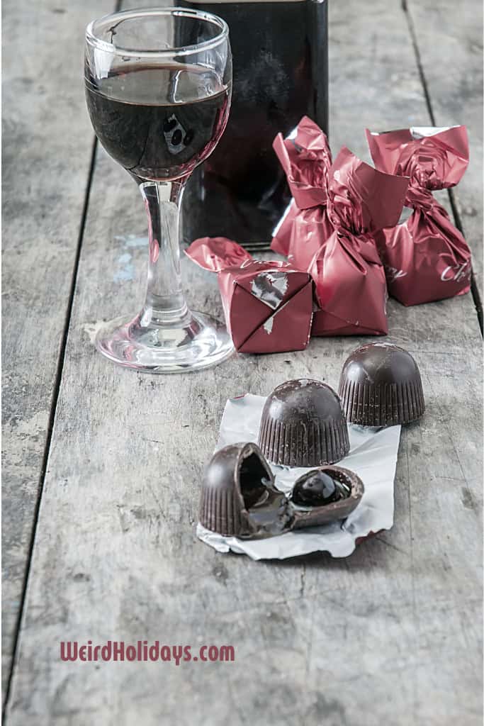 chocolate covered cherries with a glass of red wine