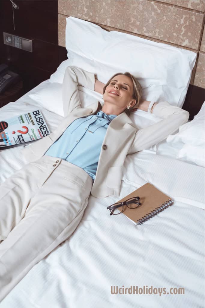 relaxed and happy woman laying on her bed