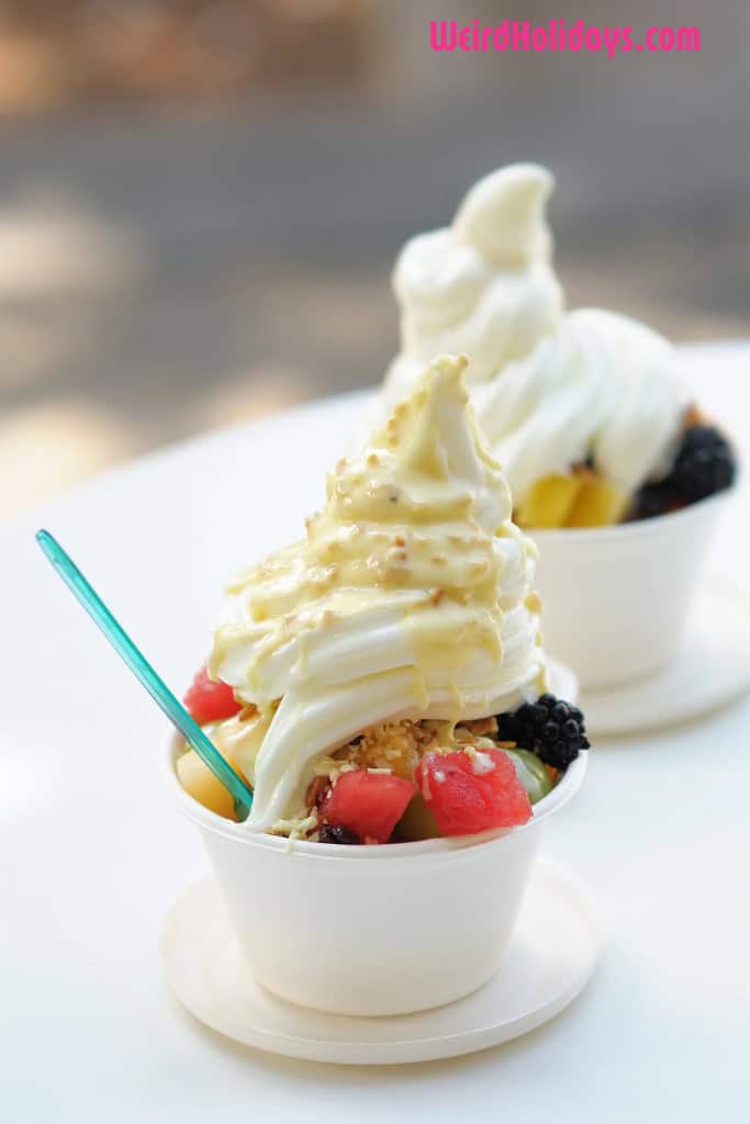 frozen yogurt in a bowl with a green spoon