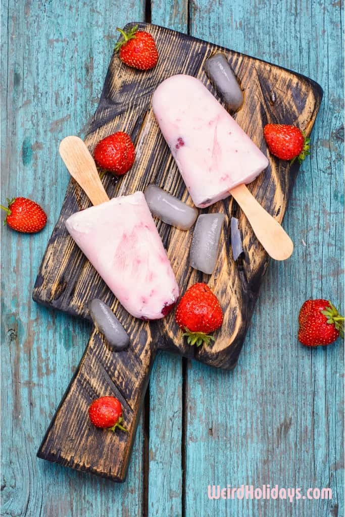 homemade strawberry ice cream lollies with strawberries on the side