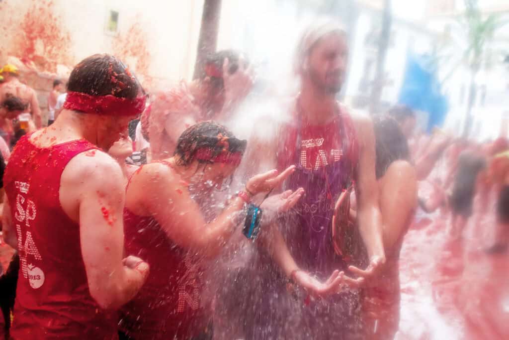 People taking part in La Tomatina, Spain's famous tomato-throwing festival