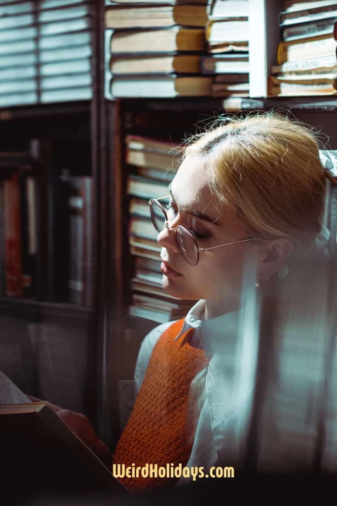 woman reading a book in a library