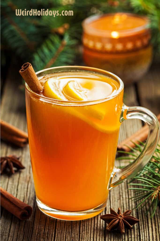 hot toddy drink with lemon and cinammon stick