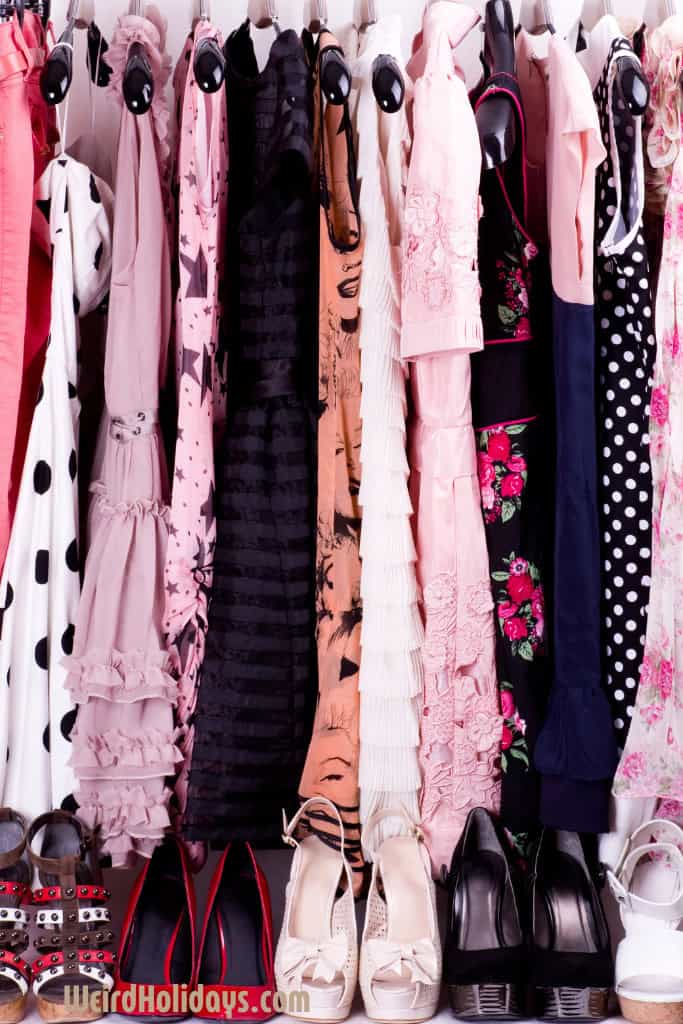 pink clothes hanging neatly with shoes below