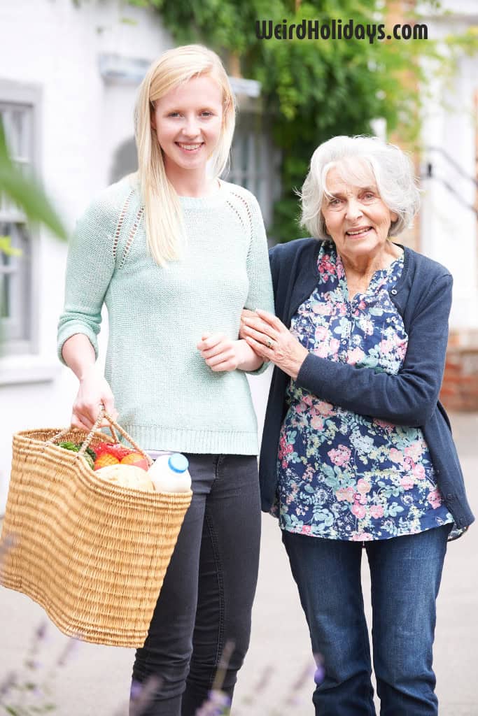 a young woman helping an elderly woman with her shopping