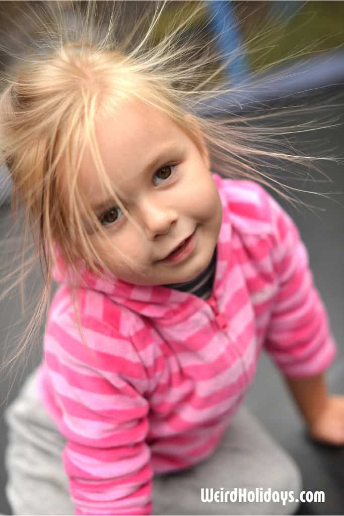 blond girl with her hair flying around after static electricity