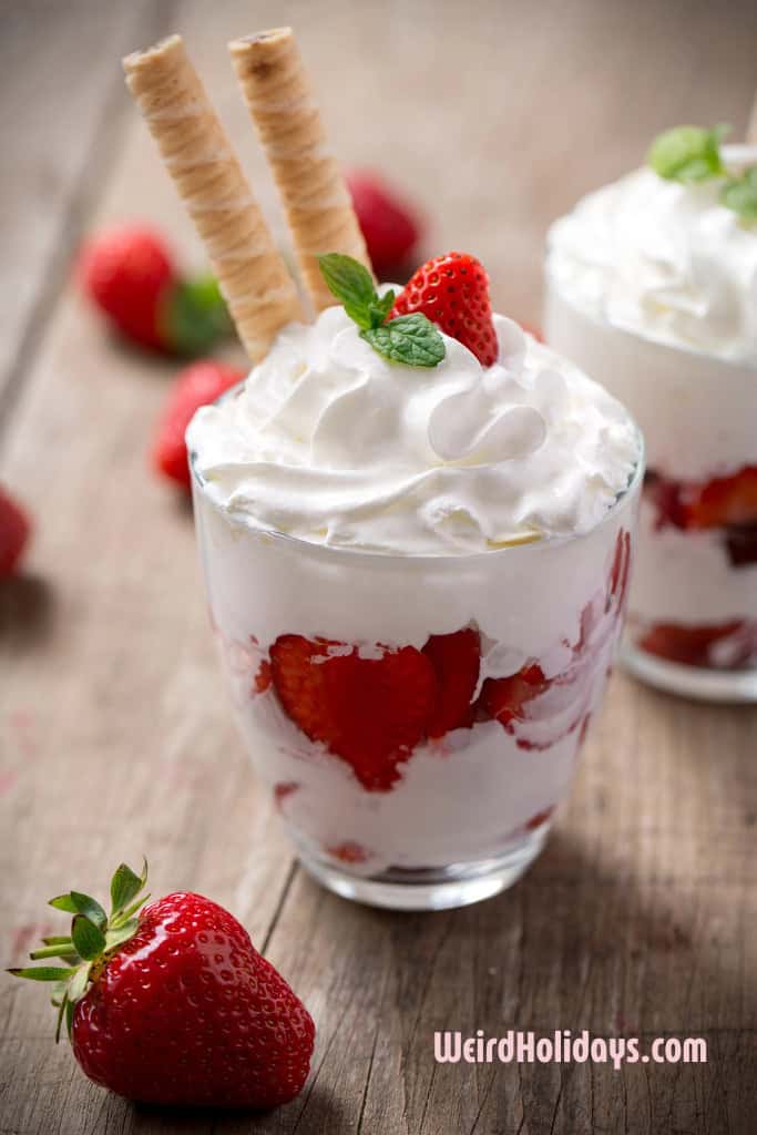 whipped cream on top of a strawberry milkshake