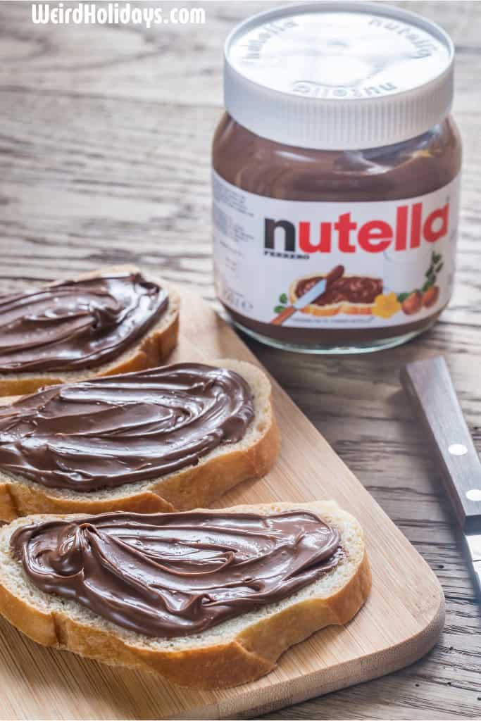 3 slices of toast with nutella on them and a pot of nutella and a knife next to them