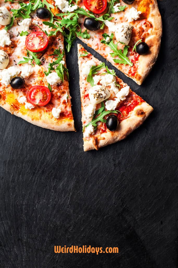 pizza on a black board