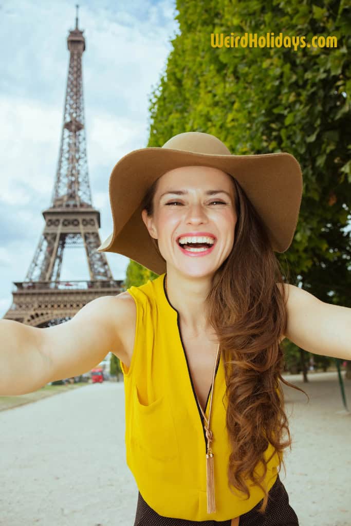 lady wearing a yellow top in front of the eiffel tower