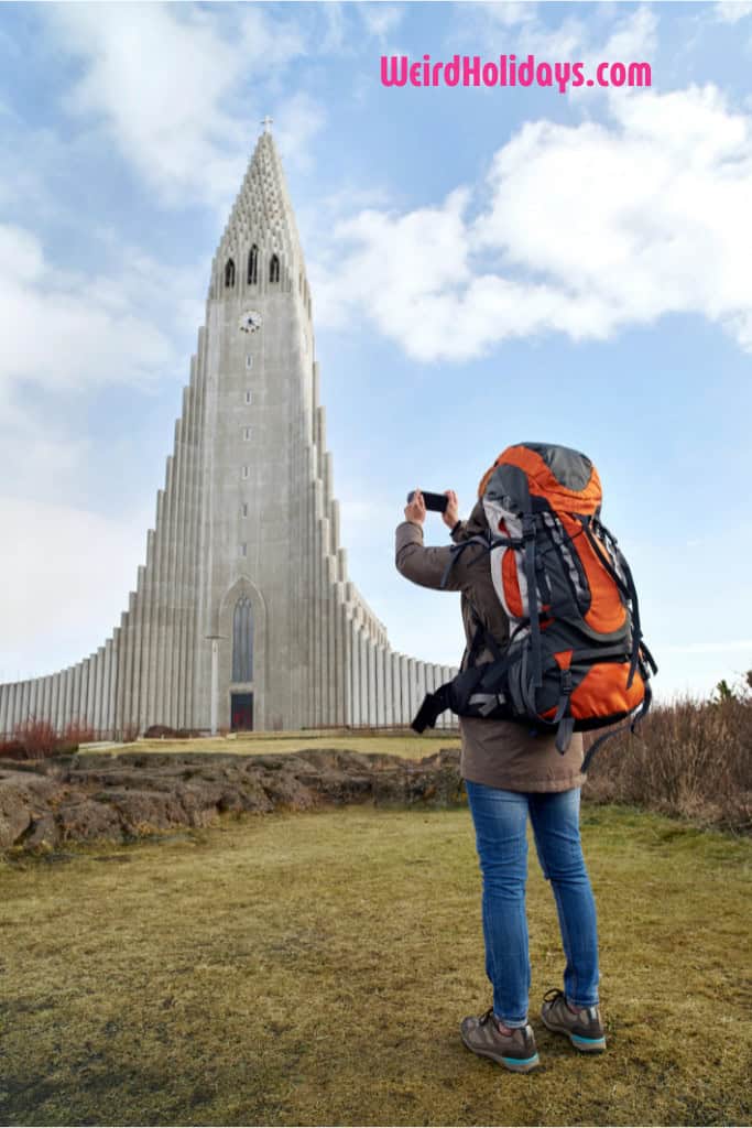 man backpacking taking a photo