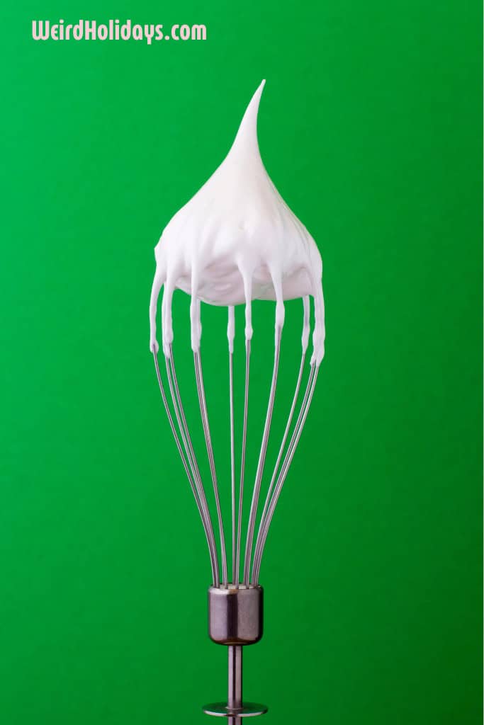 whisk with whipped cream on it