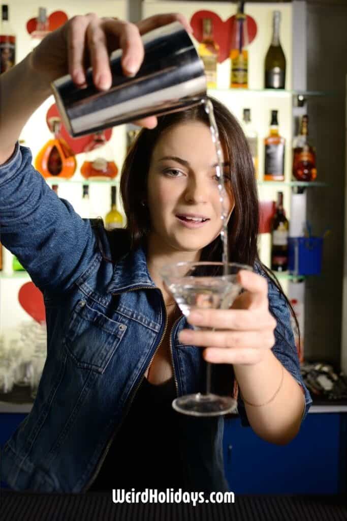 lady pouring a cocktail in a bar